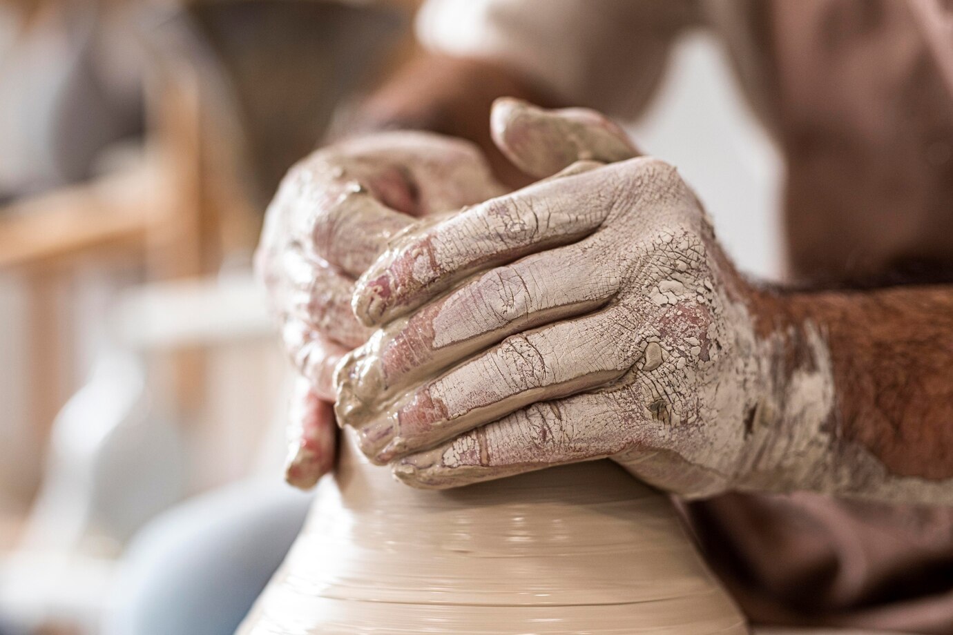Hands doing pottery close up 23 2148986300